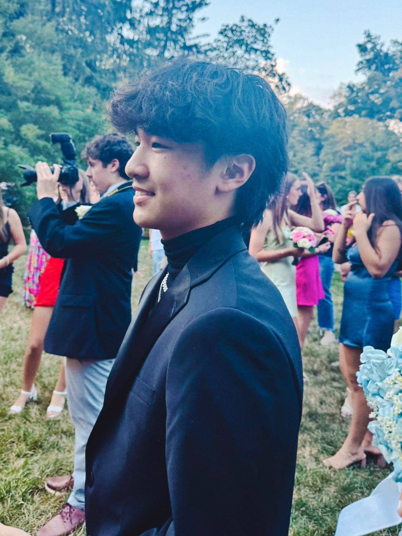 Teen with camera outdoors